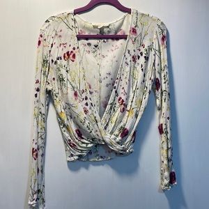 Small white floral wrap shirt. Slight bell sleeve